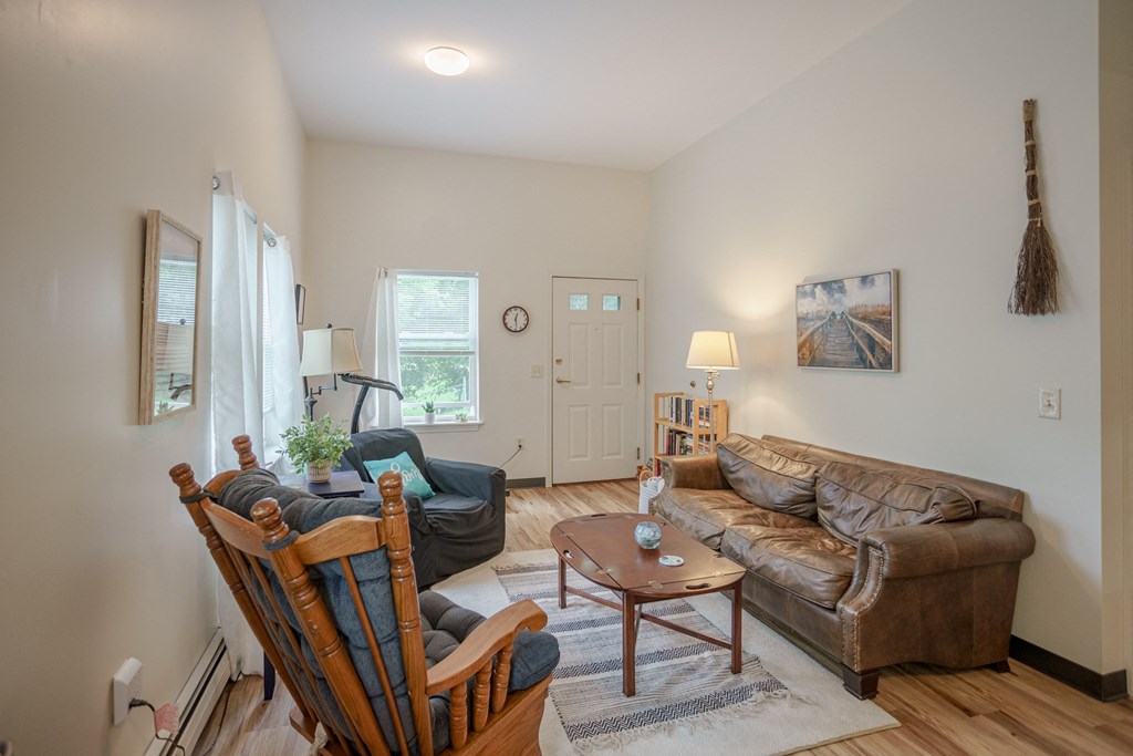 a living room with two couches and chairs and a table