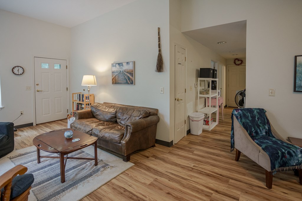 a living room with a leather couch and a coffee table