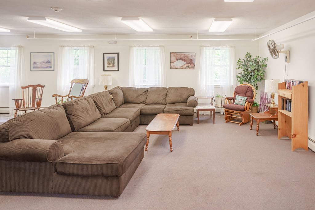 a living room with a large couch and a table