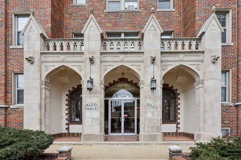 The entrance to a building with a sign that reads