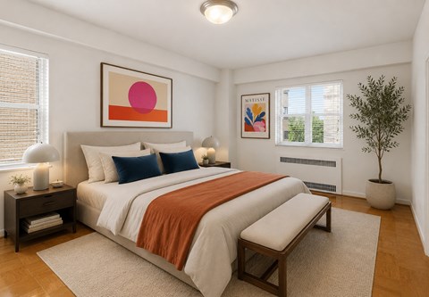 A bedroom with a large bed and a painting on the wall.