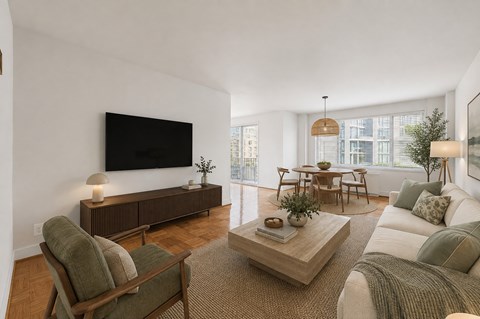 A living room with a flat screen TV mounted on the wall.