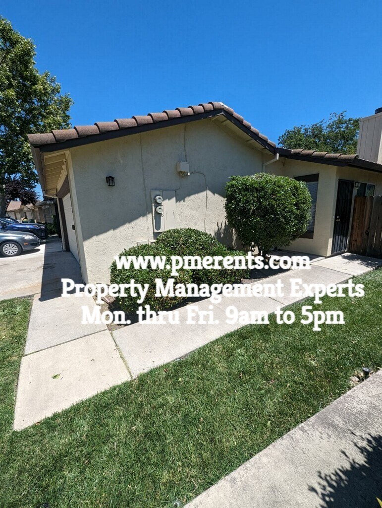 a house with a lawn in front of it  property management experts