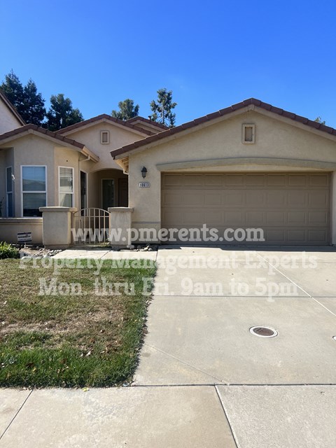 a house with a driveway and a garage door
