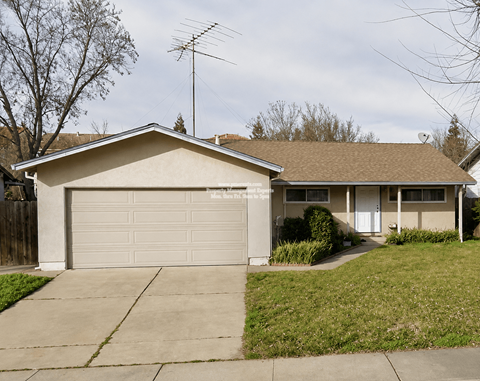 A house with a garage and a driveway.