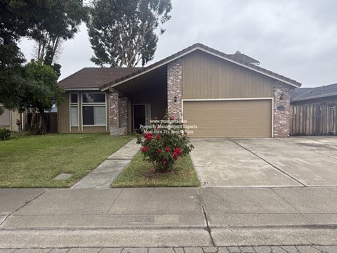 A house with a garage and a driveway.