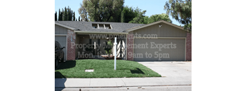 a house with a yard in front of it