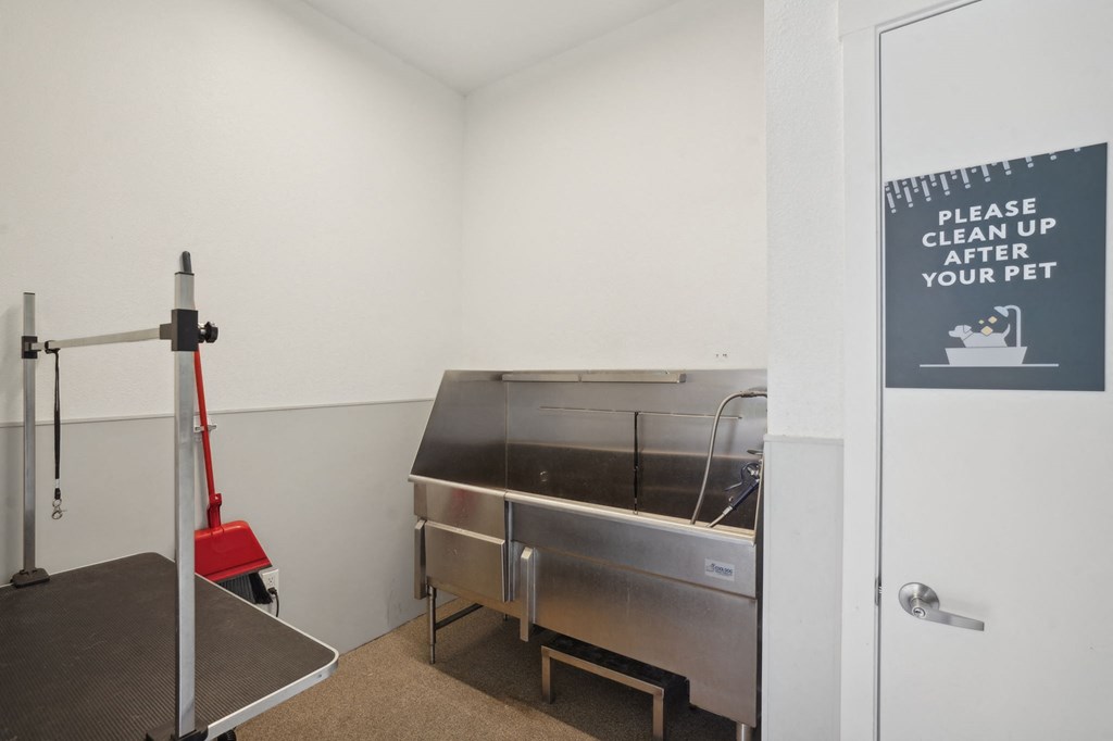 a kitchen with a stainless steel counter and a glass door