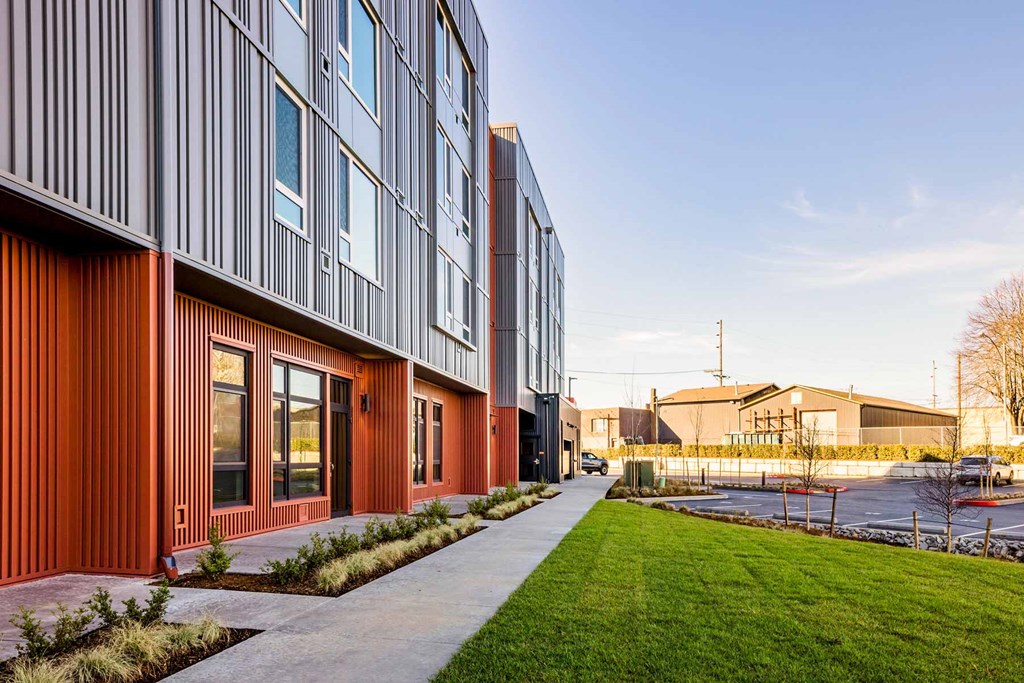 a building with a sidewalk in front of it