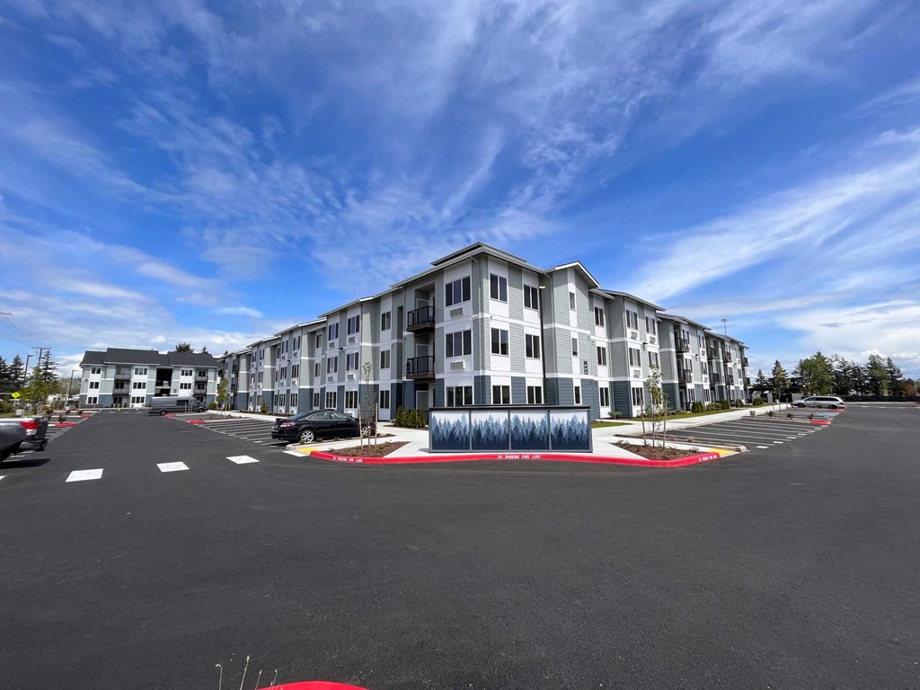 a building with a parking lot in front of it
