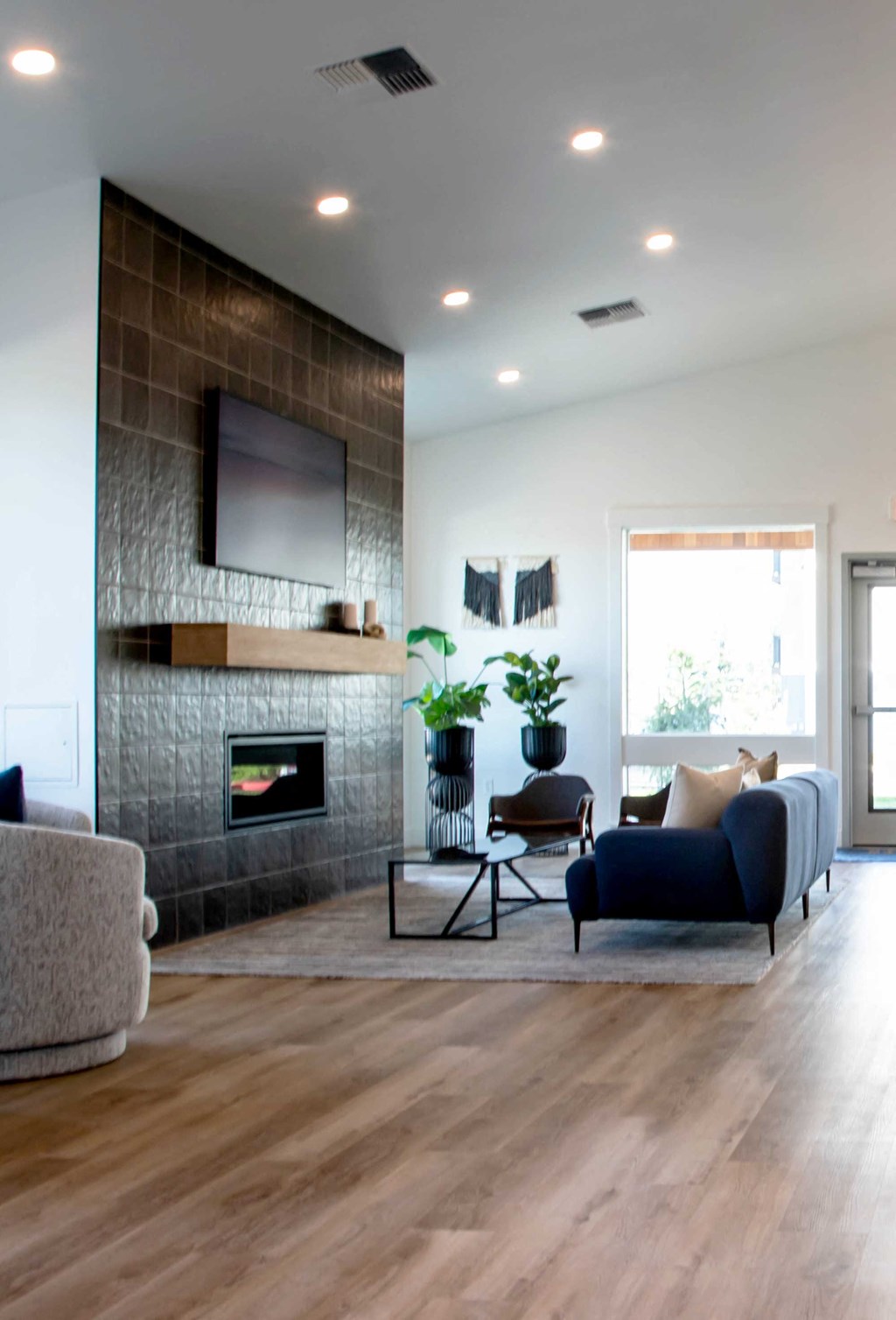 a modern living room with a fireplace and tv