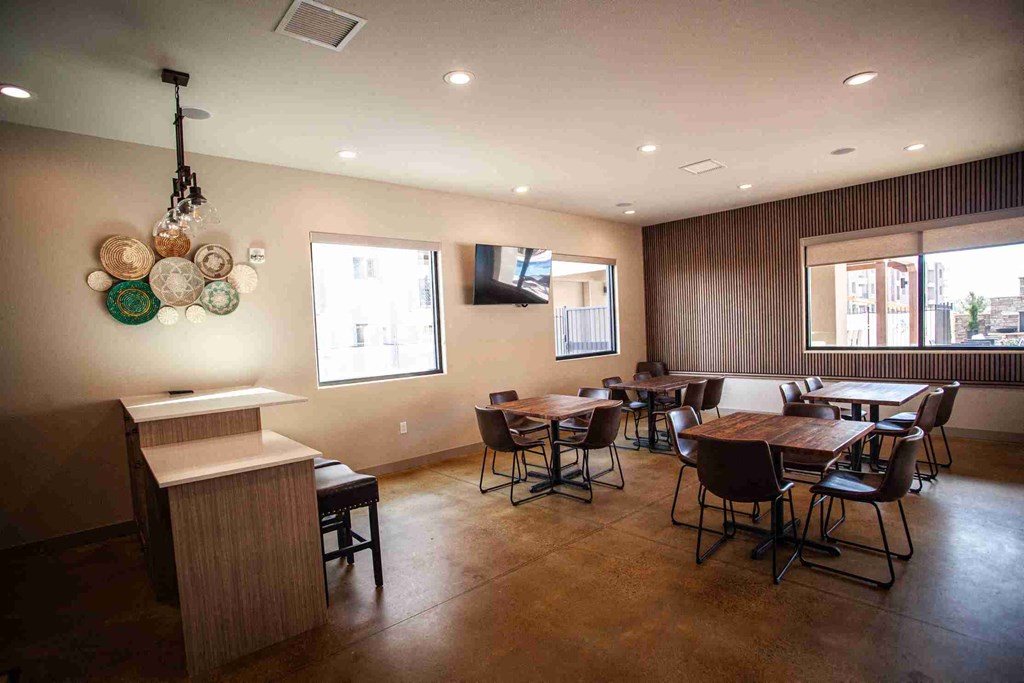 Party room with chairs and a wooden table.