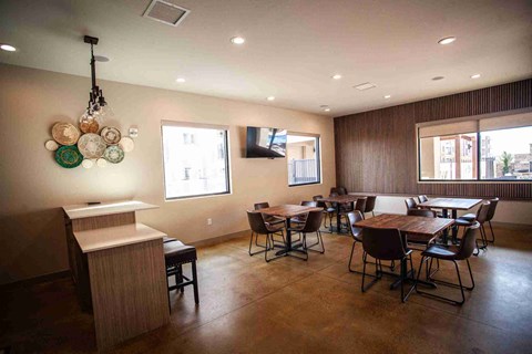 Party room with chairs and a wooden table.