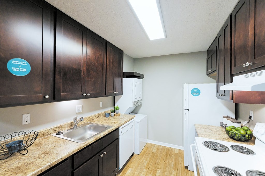 a kitchen with a stove sink and refrigerator at Cedar Run Apartments, Memphis, Tennessee