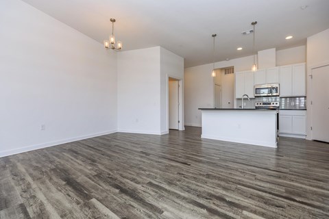 A kitchen area with a countertop and cabinets.