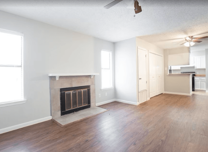 A living room with a fireplace and wood flooring  at Callaghan Heights, TX, 78228