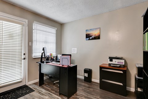an office with a desk and a printer and a door at The Crossings at Montrose Apartments, Texas, 78223