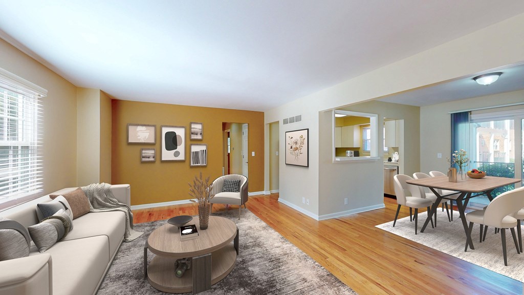 A living room with a grey couch and a coffee table.