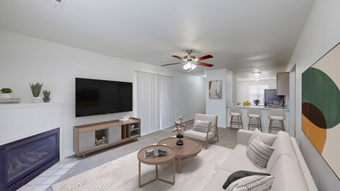 A living room with a fireplace and a television.