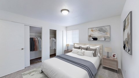 A bedroom with a large bed and a painting on the wall.
