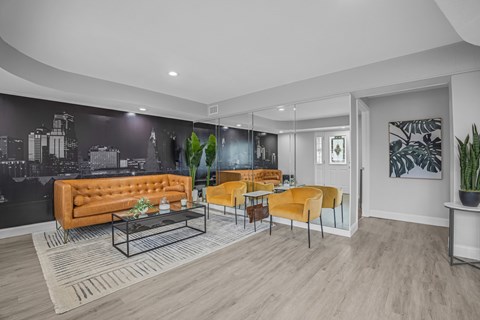 A modern living room with a black mural on the wall.