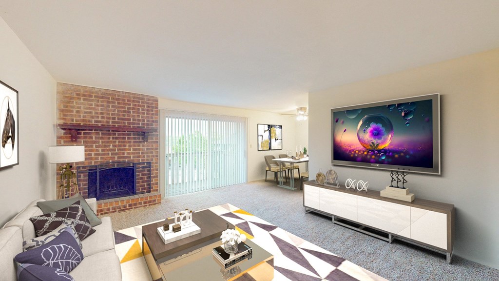 an open living room with a fireplace and a tv on the wall