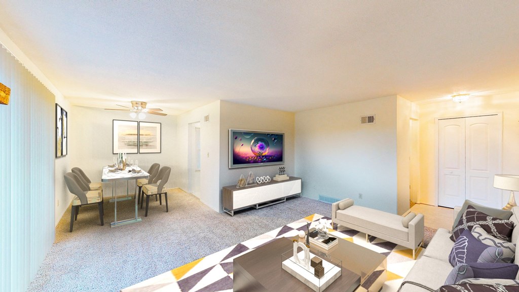 a living room with a couch and a table and a television