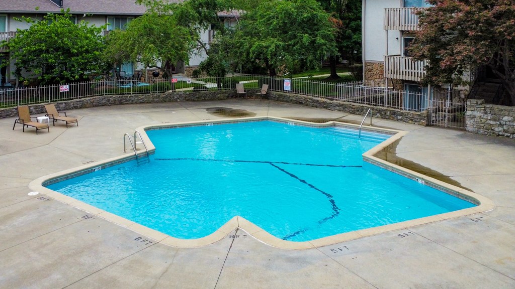 the pool at our apartments is a big blue swimming pool