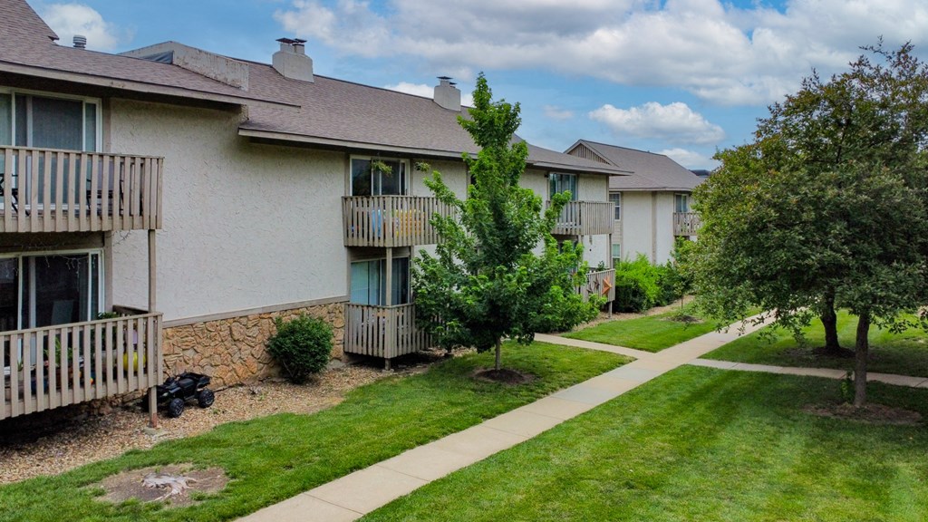 our apartments are located in a quiet neighborhood with trees and grass