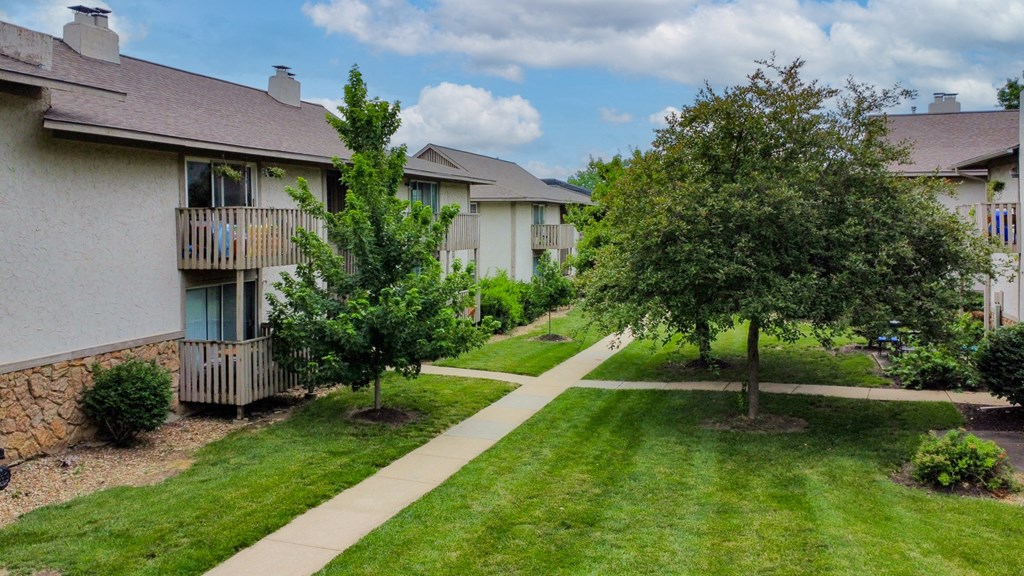 our apartments are located in a quiet neighborhood with trees and grass