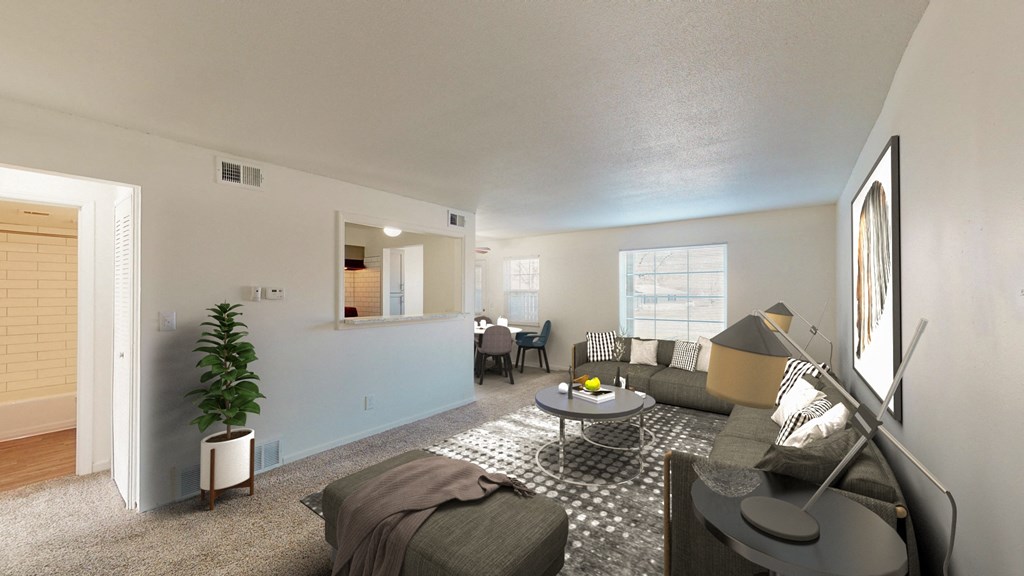 the living room of an apartment with a couch and a table