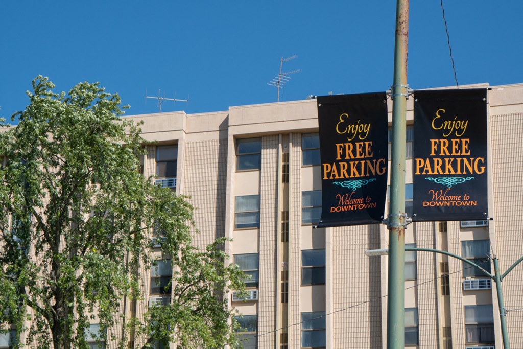 a large building with signs in front of it saying enjoy free parking