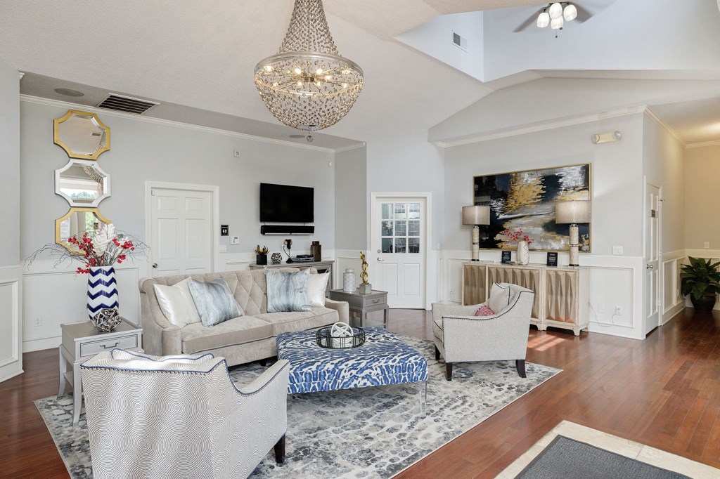 a living room with couches and chairs