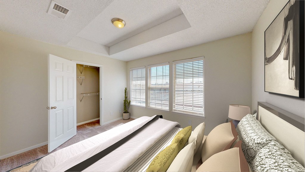 a bedroom with a large bed and a door to a closet