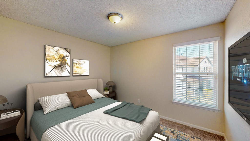 a bedroom with a large bed and a window