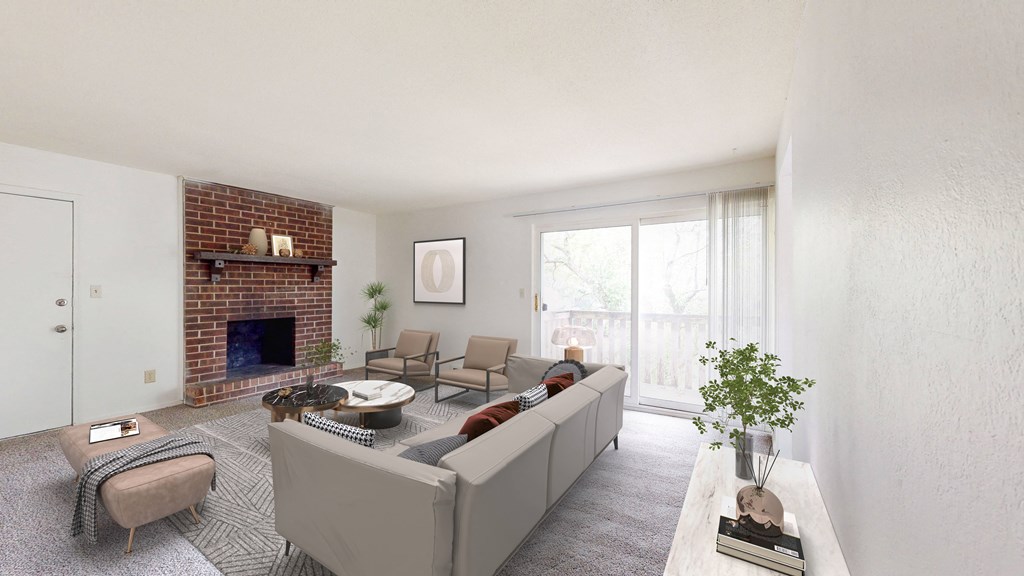 a living room with a white couch and a brick fireplace