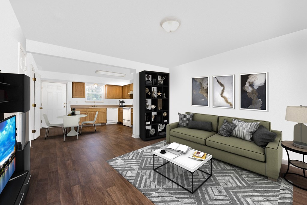 A living room with a green couch and a coffee table.