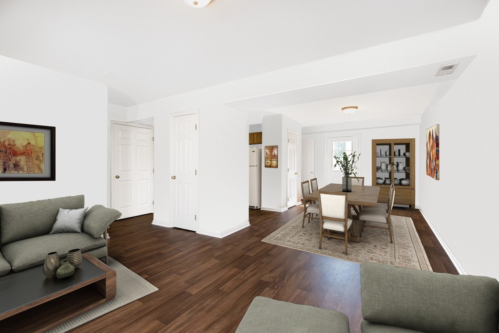A living room with a grey couch and a coffee table.