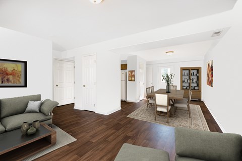 A living room with a grey couch and a coffee table.