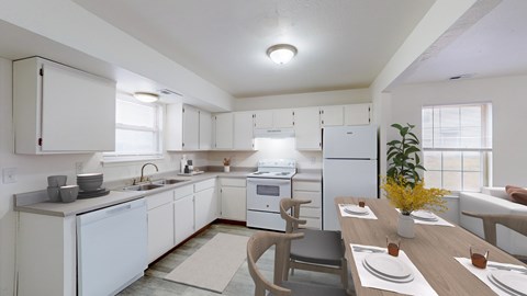 A modern kitchen with white appliances and a dining table set for two.