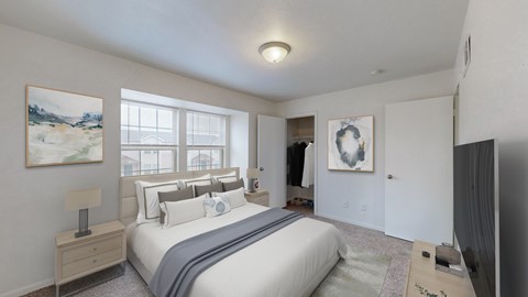 A bedroom with a large bed and a painting on the wall.