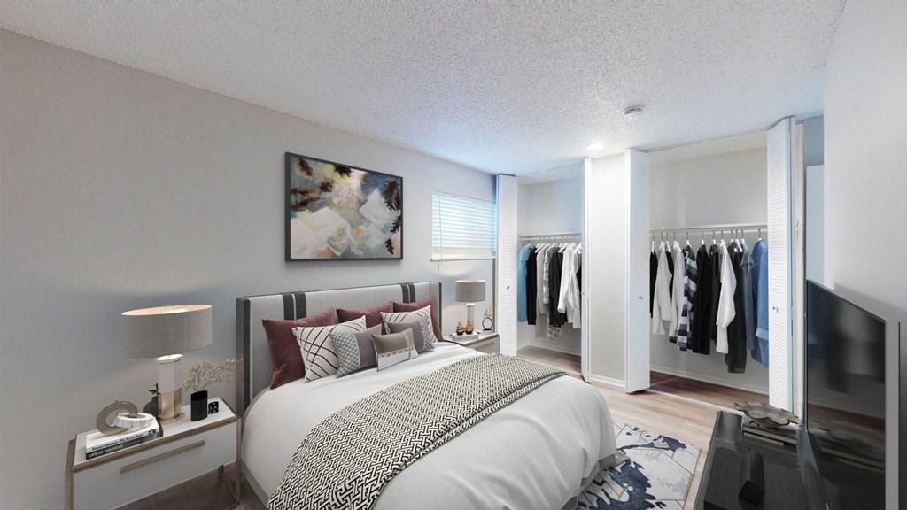 A bedroom with a large bed and a wardrobe.