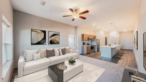 A modern living room with a white sofa and a coffee table.