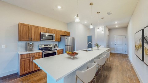 A kitchen with a white table and chairs.