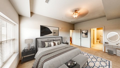 A bedroom with a large bed and a ceiling fan.