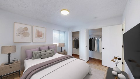 A bedroom with a large bed and a wardrobe.