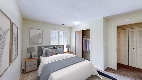 A bedroom with a large bed and a window.