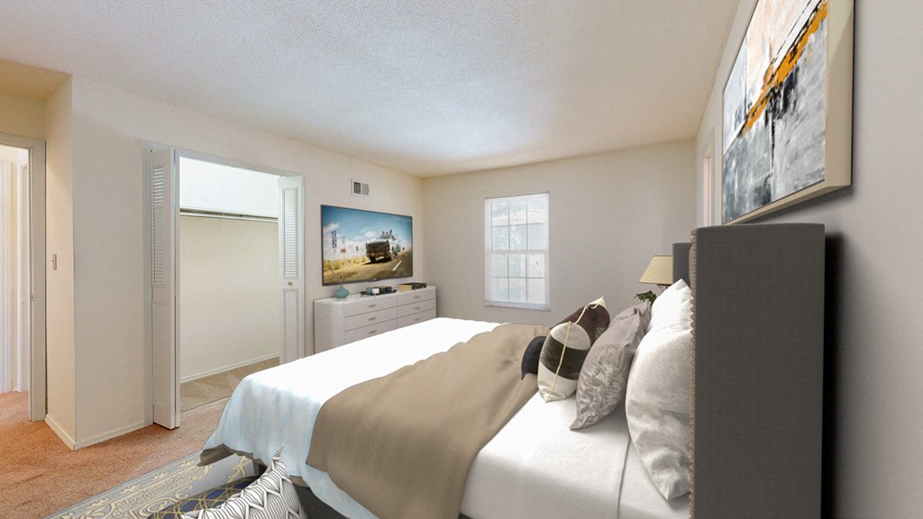 a bedroom with a large bed and a closet