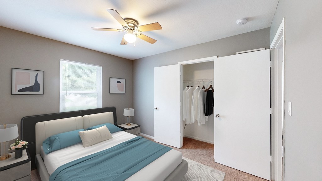 a bedroom with a bed and a ceiling fan