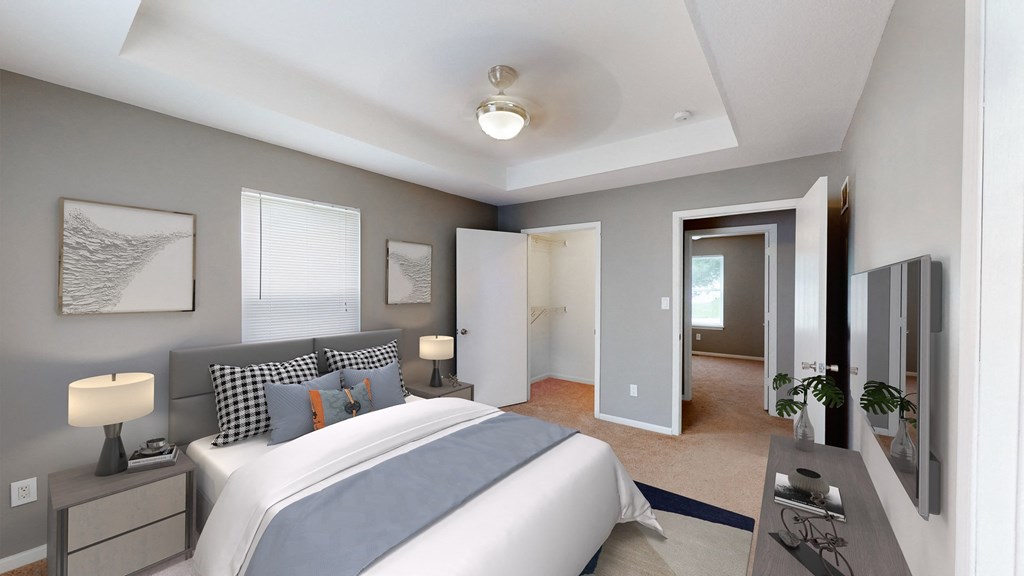 a bedroom with a large bed and a closet